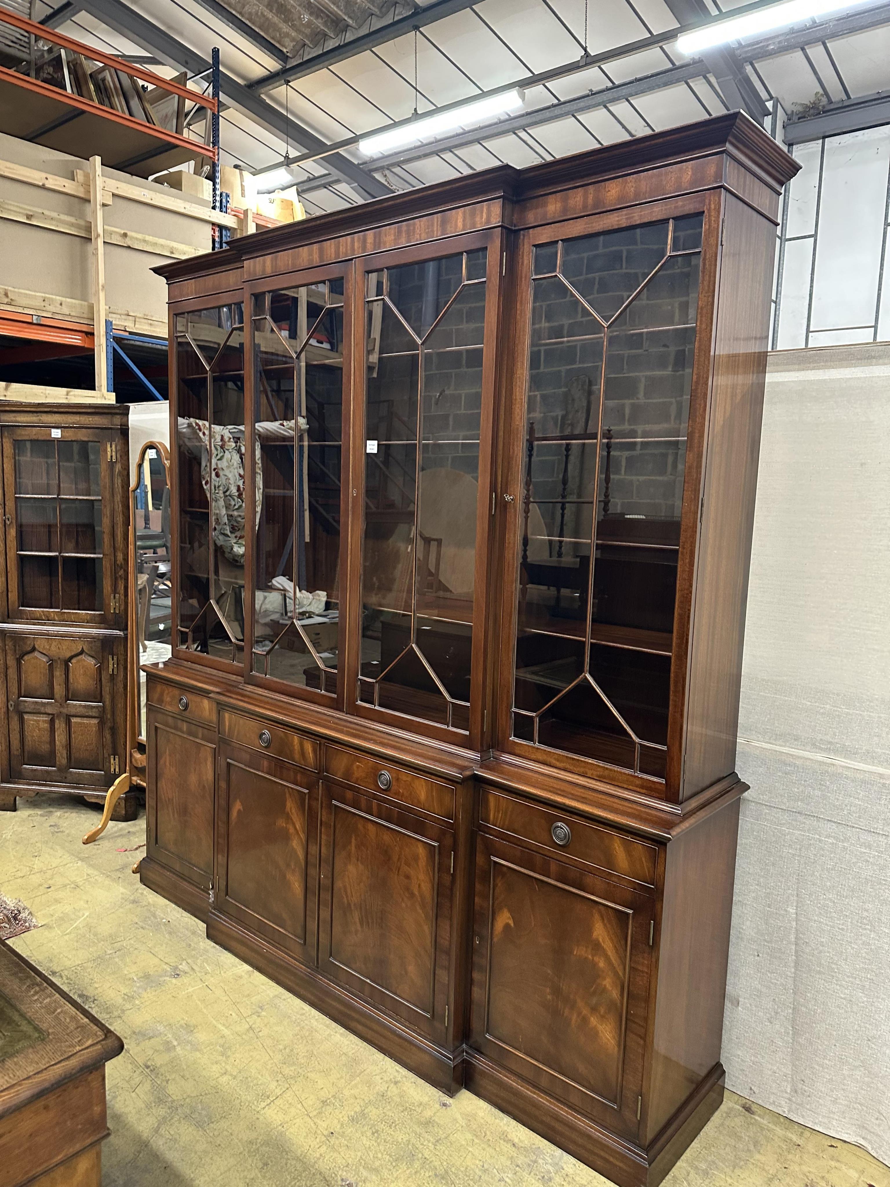 A reproduction George III style mahogany breakfront library bookcase, width 204cm, depth 48cm, height 220cm. Condition - good